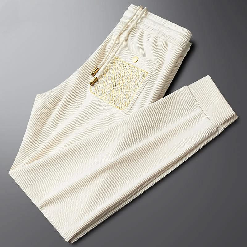 Off-white ribbed cotton pants with elastic waistband, side pocket and drawstring