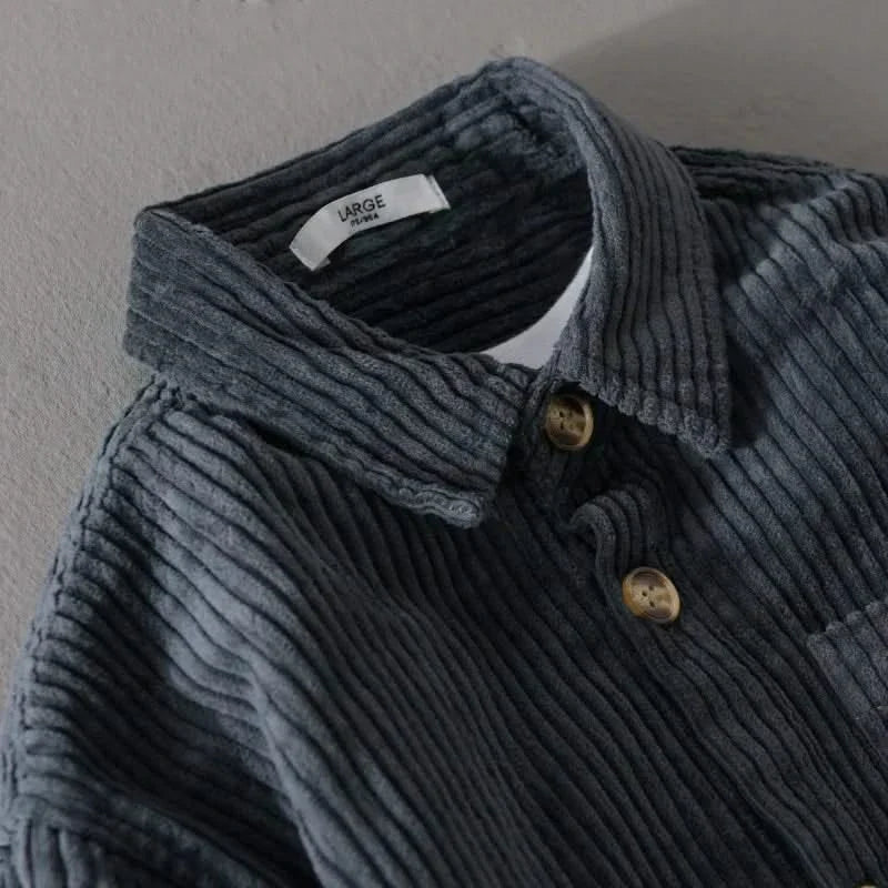 Navy corduroy shirt collar and button placket detail with buttons