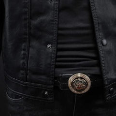 Black leather jacket close-up of snaps, shirt front, and decorative belt buckle.