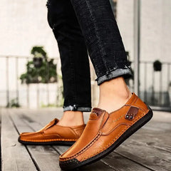 Tan-brown leather slip-on loafer with bit detail and stitched sole
