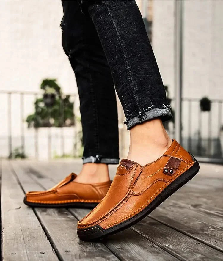 Tan-brown leather slip-on loafer with bit detail and stitched sole