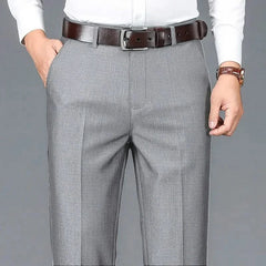 Gray dress trousers with belt loops, zip fly, and straight-leg crease lines.