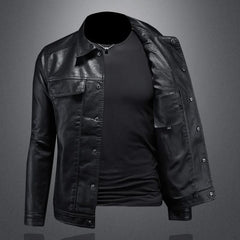 Black leather jacket with snap buttons, chest flap pocket, open side view.