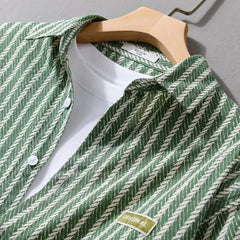 Olive green pinstripe layered shirt close-up, point collar and front label patch