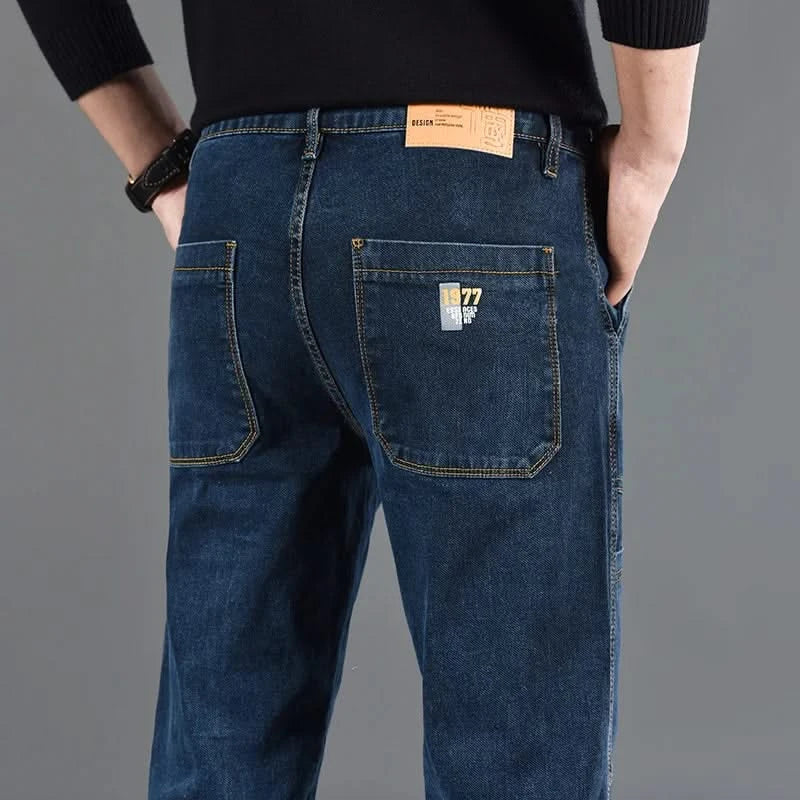 Blue utility jeans with multiple patch pockets and a branded back waist label