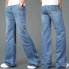 Light blue flare boot cut jeans with side whiskering and relaxed wide-leg opening