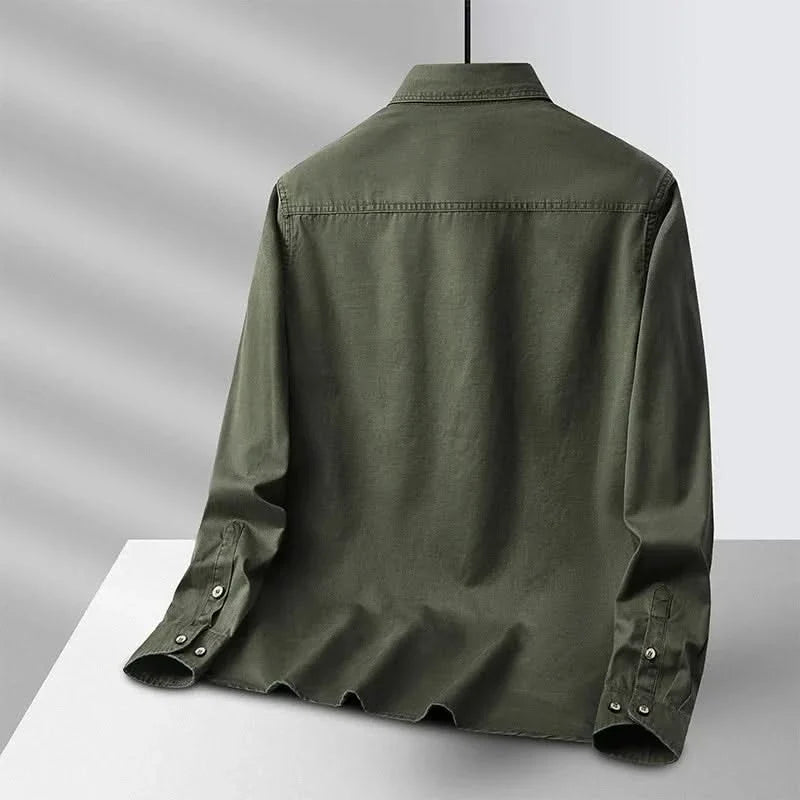 Back view of green canvas overshirt with flap collar and button cuffs