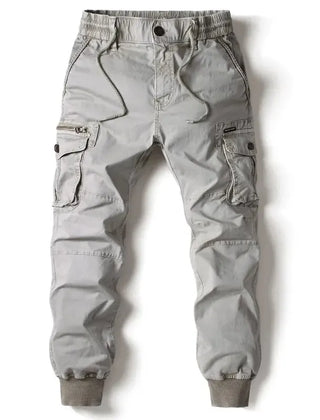 Light grey cargo pants with drawstring waist, button fly, and side cargo pockets