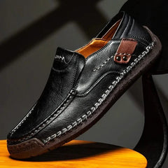 Black leather slip-on loafer with stitched moc toe and metal bit detail