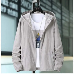 Grey hooded summer jacket with zip front and elastic cuffs, worn over a white tee