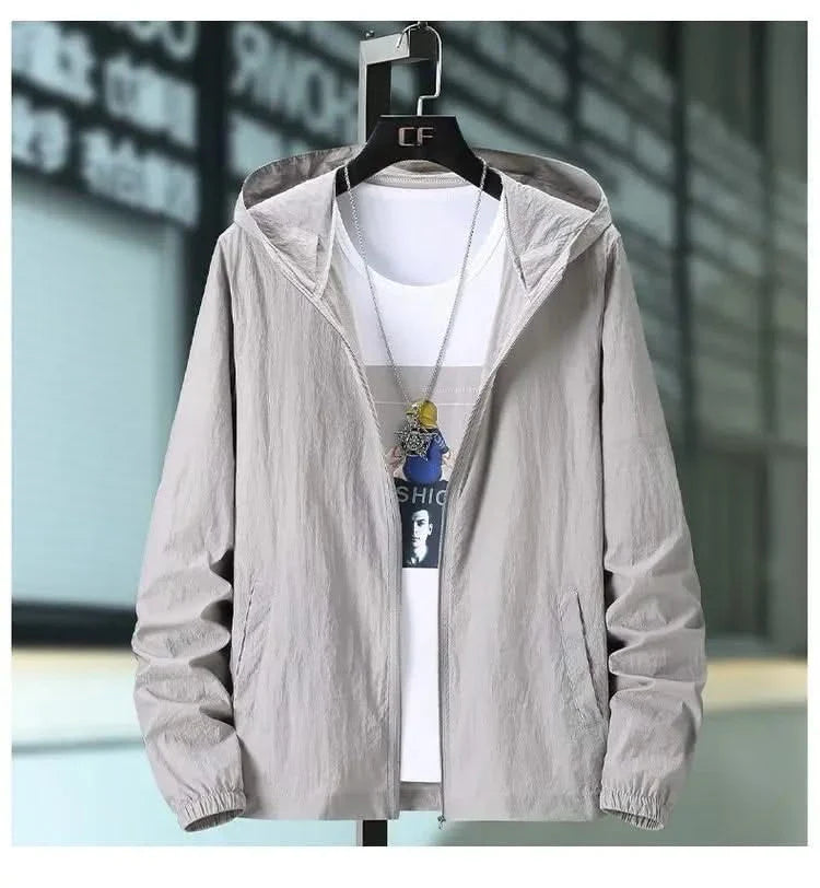 Grey hooded summer jacket with zip front and elastic cuffs, worn over a white tee