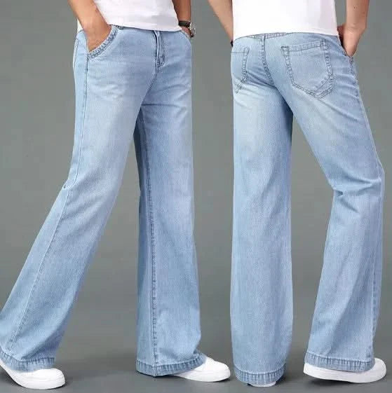 Light blue flare boot cut jeans with stitched back pockets and wide hems
