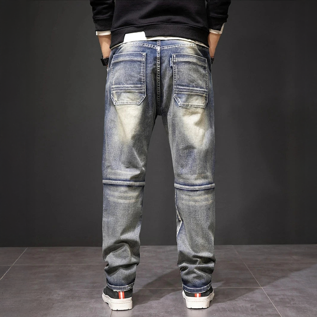 Men's straight jeans, medium blue wash with two thigh flap pockets and elastic cuff hems