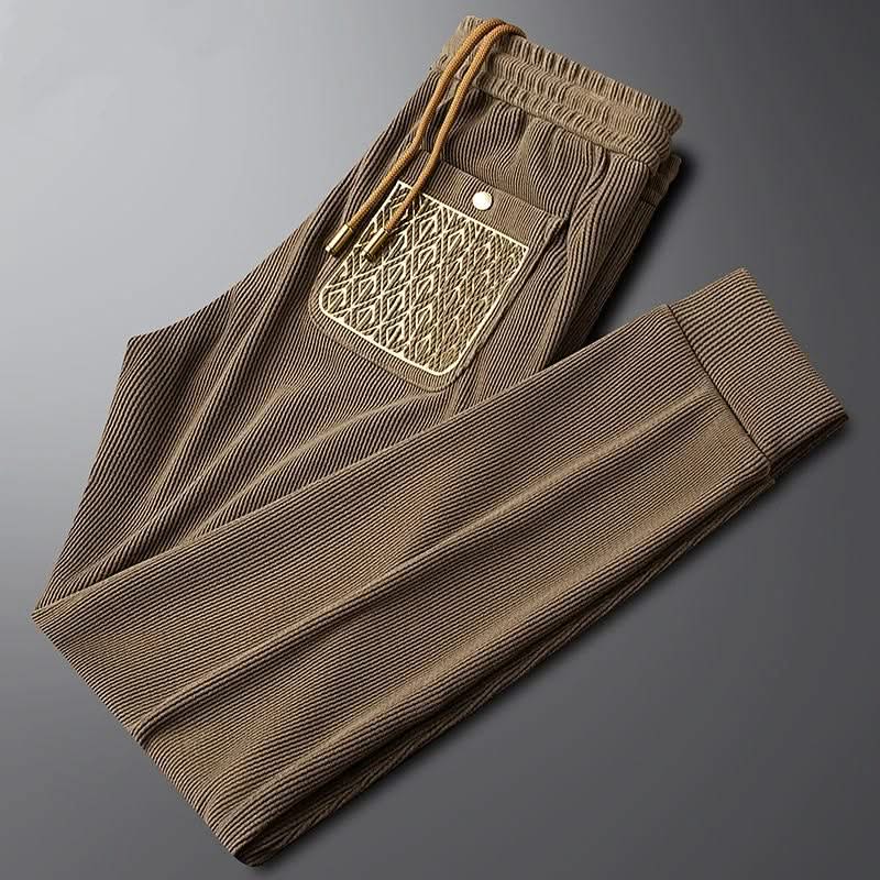 Brown ribbed cotton pants with elastic waistband and drawstring, front pocket detail