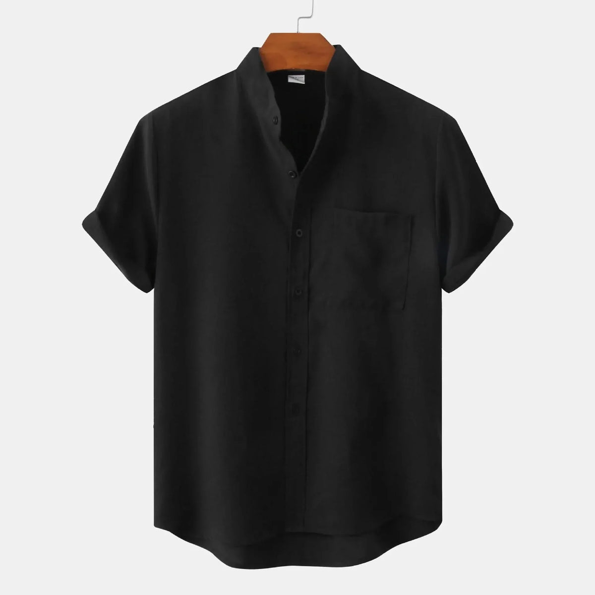 Short-sleeve button-up shirt in black with front placket and chest pocket