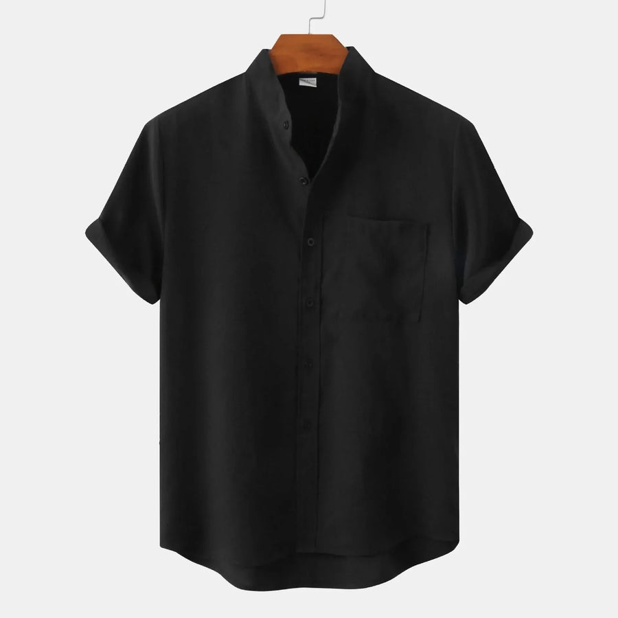 Short-sleeve button-up shirt in black with front placket and chest pocket