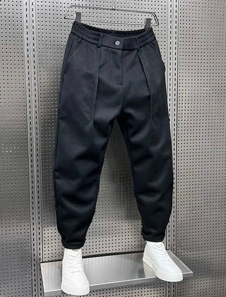 Men’s navy modern-fit trousers with pleated front, button waistband and cuffed hem