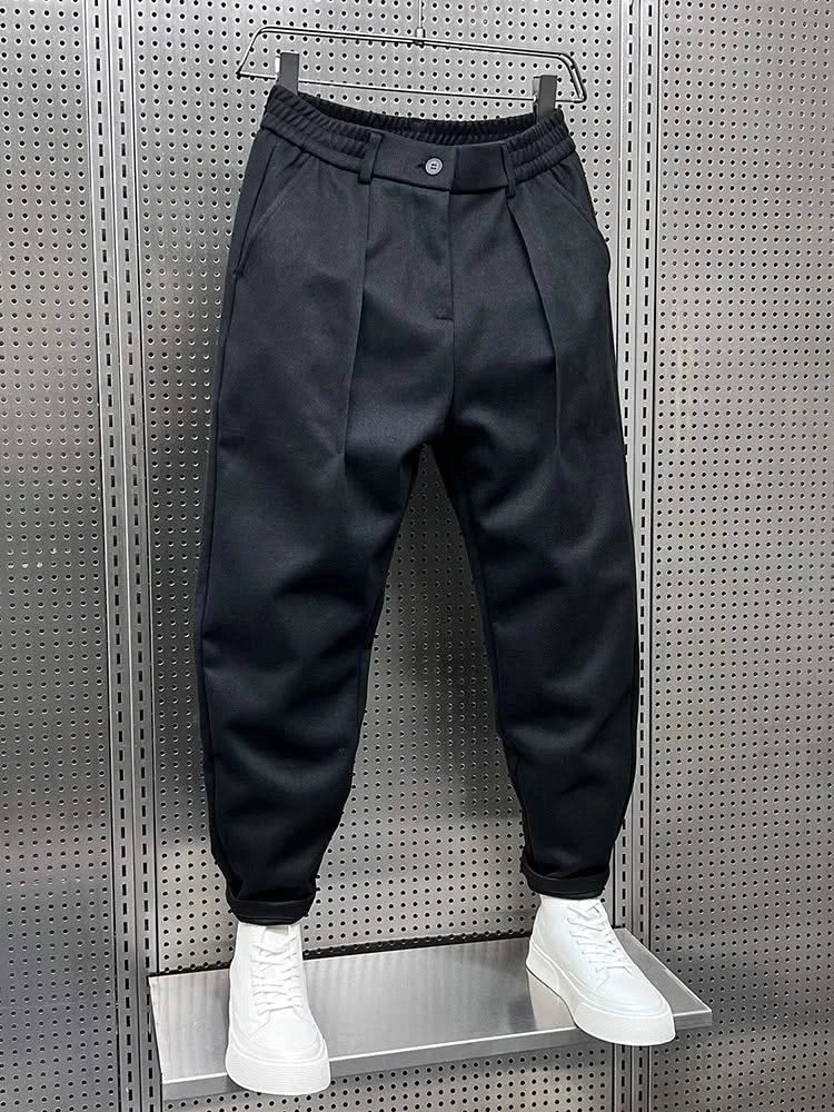 Men’s navy modern-fit trousers with pleated front, button waistband and cuffed hem