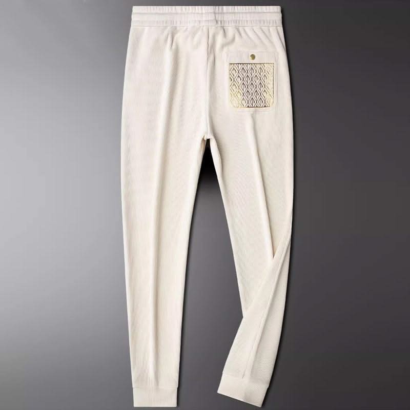 White ribbed cotton pants, elastic waist and drawstring, front pocket with pattern