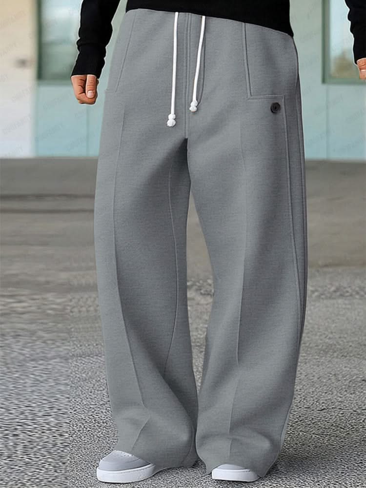 Grey wide-leg trousers with white drawstring, side pockets, and buttoned front detail