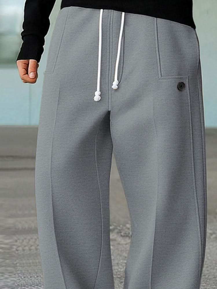 Light grey wide-leg trousers with white drawstring, side pocket, and button detail