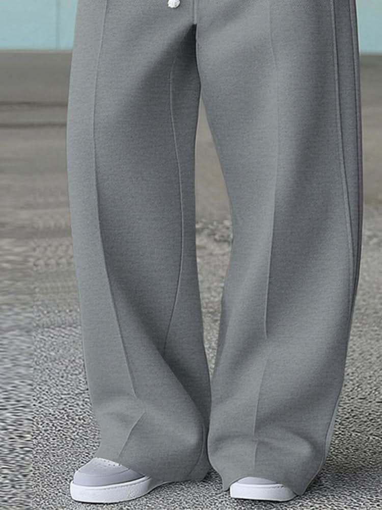 Grey wide-leg trousers with front pleat lines and wide straight leg opening
