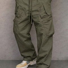 Olive green utility cargo trousers with drawstring waist and side flap pockets