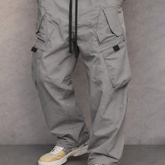Mid grey utility cargo trousers, full-length front view with drawstring waist and flap pockets