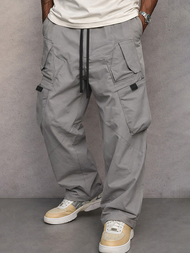 Mid grey utility cargo trousers, full-length front view with drawstring waist and flap pockets