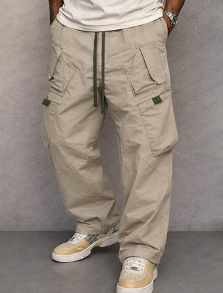 Stone beige utility cargo trousers with drawstring waist and side flap pockets