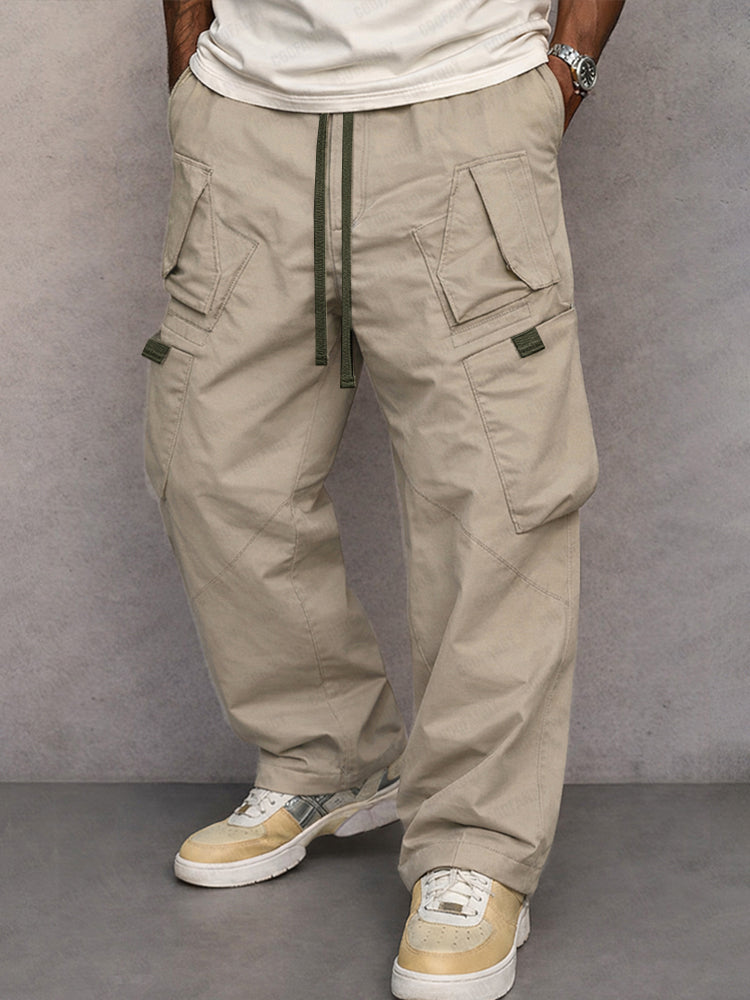 Stone beige utility cargo trousers with drawstring waist and side flap pockets