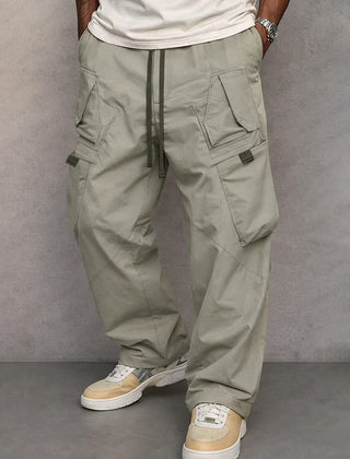 Light grey utility cargo trousers with drawstring waist and side flap pockets