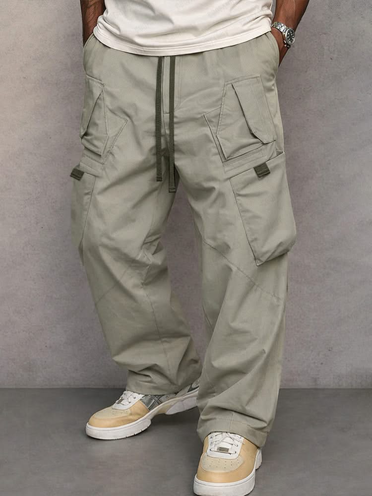 Light grey utility cargo trousers with drawstring waist and side flap pockets