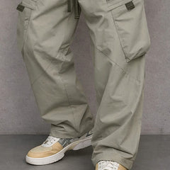 Light grey utility cargo trousers detail view with flap side pockets
