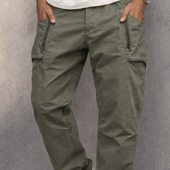 Army green cotton cargo pants with side zip pockets, relaxed tapered legs