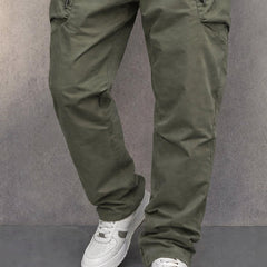 Army green cotton cargo pants with side zip pocket detail, tapered legs
