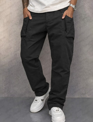 Black cotton cargo pants with side zip pockets, tapered jogger fit