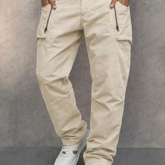 Apricot cotton cargo pants with side zip pockets, tapered jogger fit