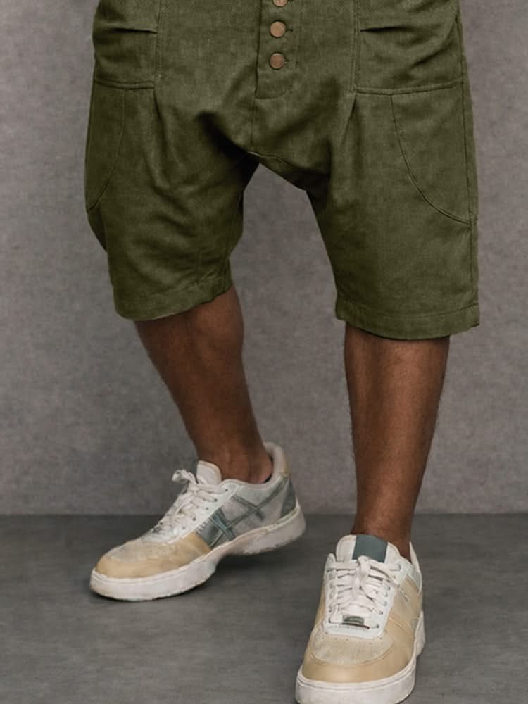 Army green casual drop-fit shorts close-up, button placket and cargo-style pockets.