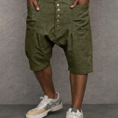 Casual drop-fit shorts in army green, front button placket and side pockets.
