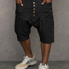 Casual drop-fit shorts in black, front button placket and side pockets.