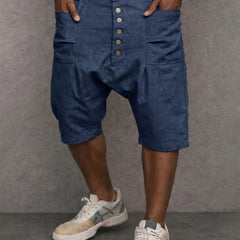 Casual drop-fit shorts in blue, front button placket and side pockets.