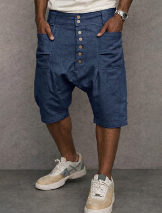Casual drop-fit shorts in blue, front button placket and side pockets.