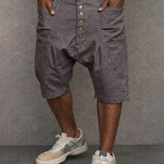 Casual drop-fit shorts in grey, front button placket and side pockets.