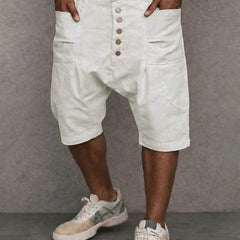 Casual drop-fit shorts in white, front button placket and side pockets.