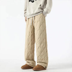 Beige quilted jogger pants with elastic cuffs and sherpa-fleece trim, drawstring waist