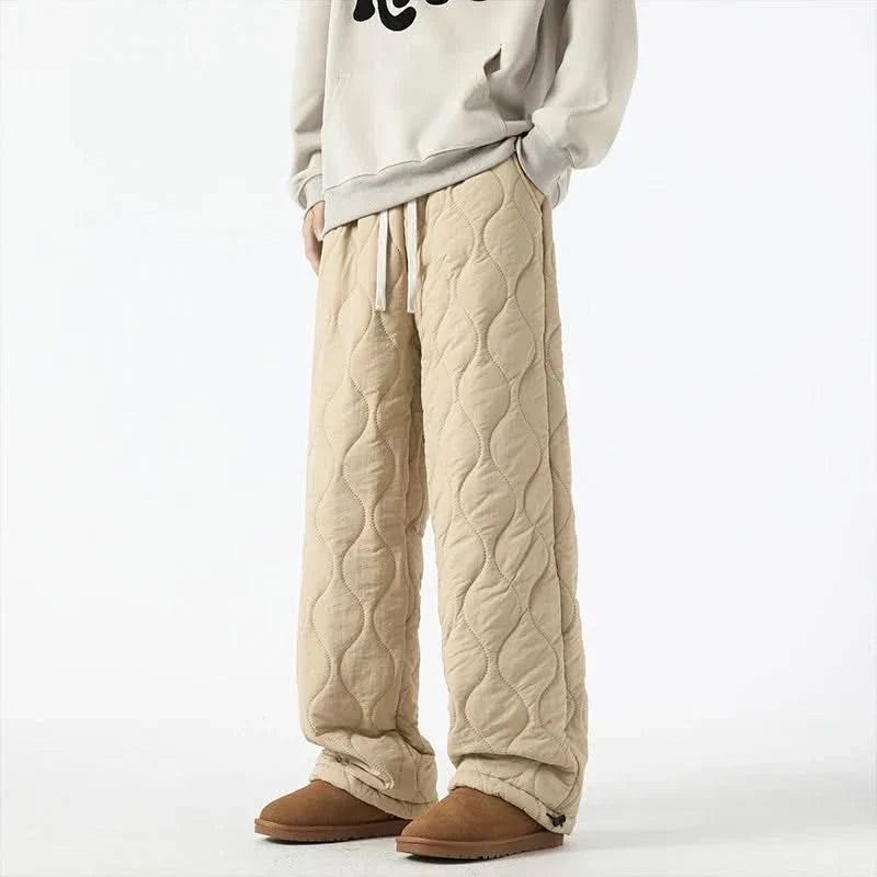 Beige quilted jogger pants with elastic cuffs and sherpa-fleece trim, drawstring waist