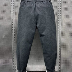 Men’s dark-grey modern-fit trousers with side pockets, elastic waistband and cuffed hem