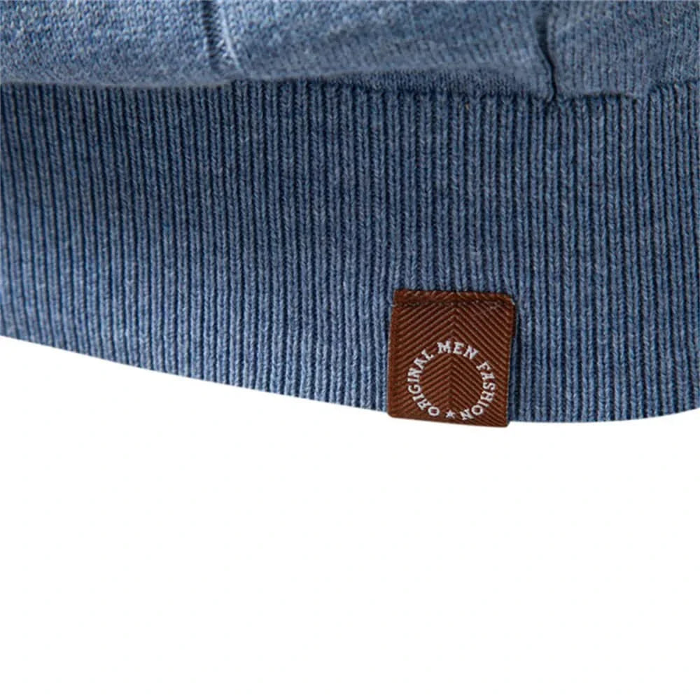 Blue ribbed hem with brown logo patch on premium knit tee