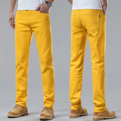 Yellow denim jeans on-model, straight-leg fit with belt loops and front pockets